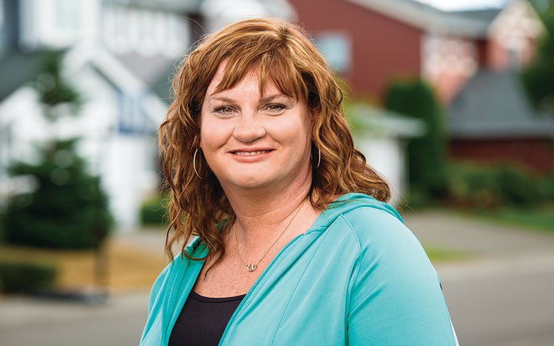 redheaded woman standing in neighborhood