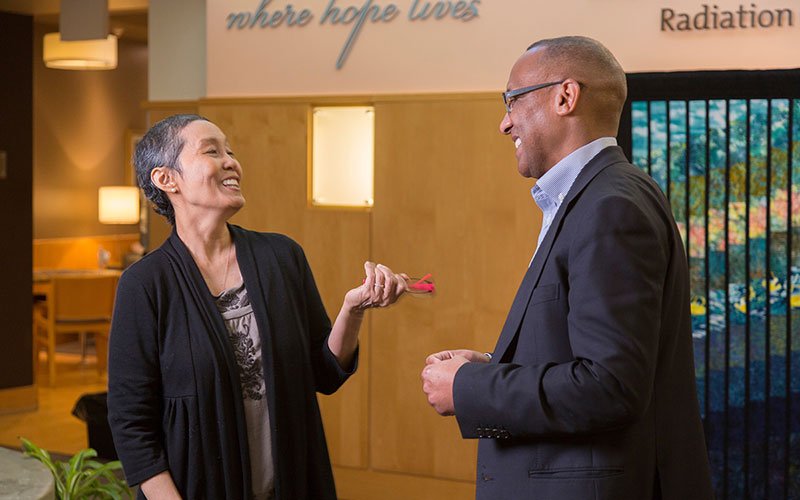 two people talking and laughing