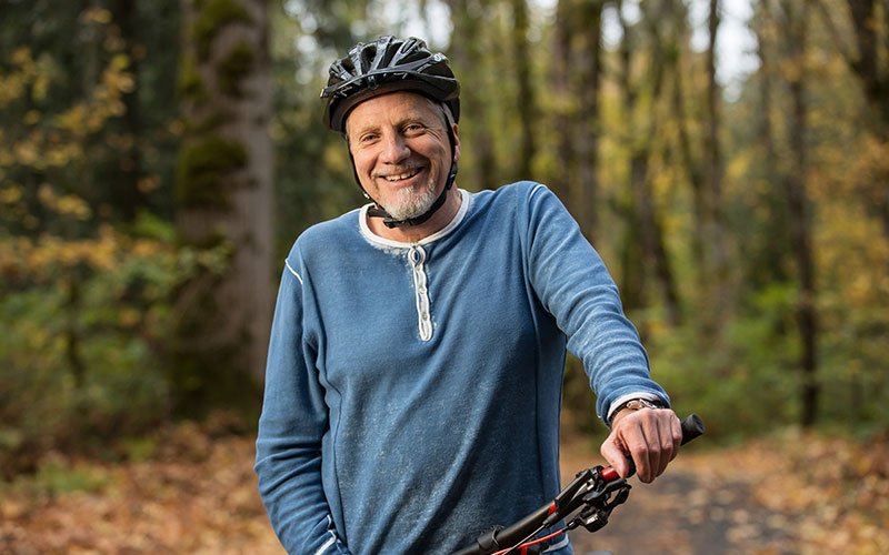 man on bike in the woods